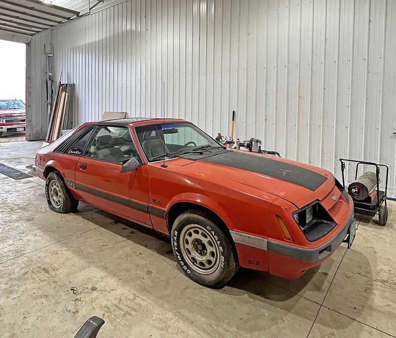 The Mustang is stored and worked on in a shed. Photo by Wanda Hanson