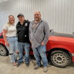 From left to right: Jasmine Schuler, Danny Marks and his dad Matt Helgeson pose with the Mustang. Photo by Wanda Hanson