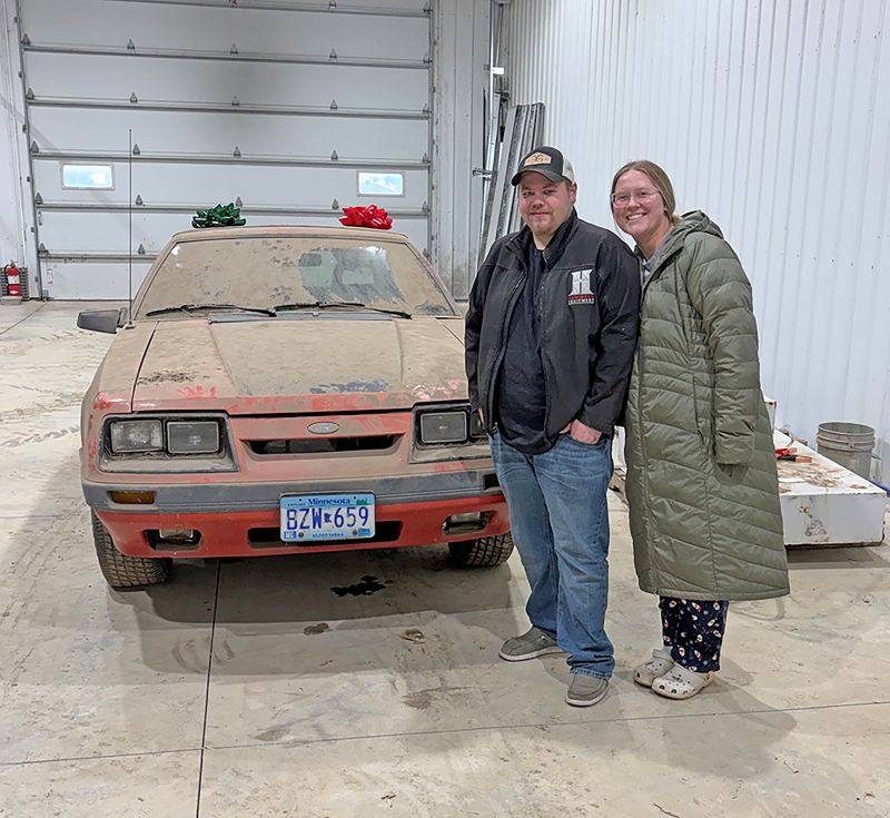 Danny and Jasmine with the car right after Jasmine surprised Danny with it at Christmas. Photo submitted