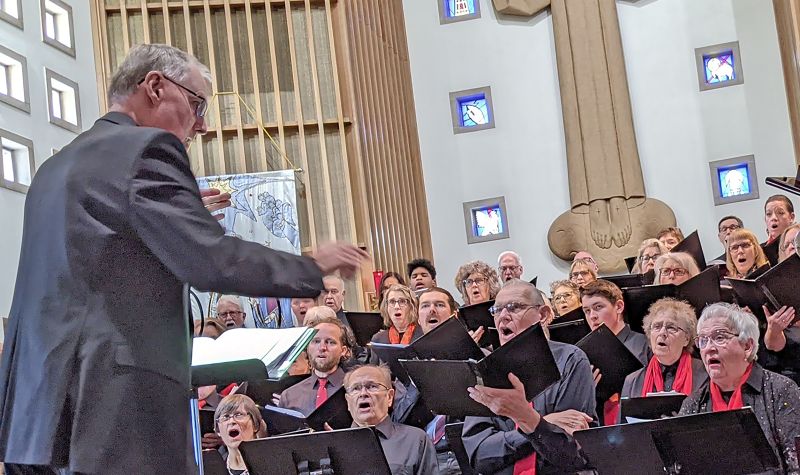Director of the Bluff Country Singers, Elliott Grandall’s enthusiasm for musical performance is contagious for both choir members and their audiences.Photo by SimplyMary
