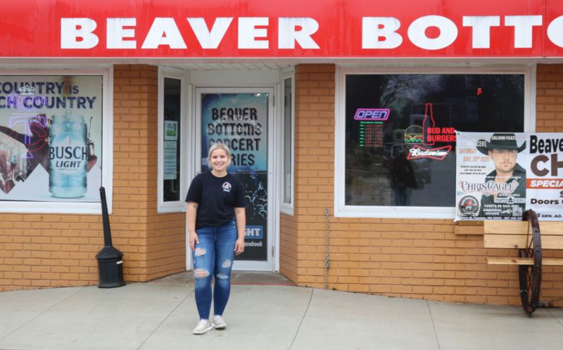 Kylie Ramsey stands outside of Beaver Bottoms Saloon which she recently purchased at the age of 21. Photo by Barb Jeffers