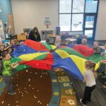 Preschoolers making it snow after reading “The Snowy Day” by Ezra Jack Keats. Photo submitted