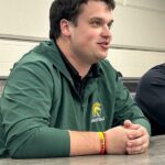 Head Football Coach Robbie Strand shared details of the girls flag football team with the board. Photo by Wanda Hanson