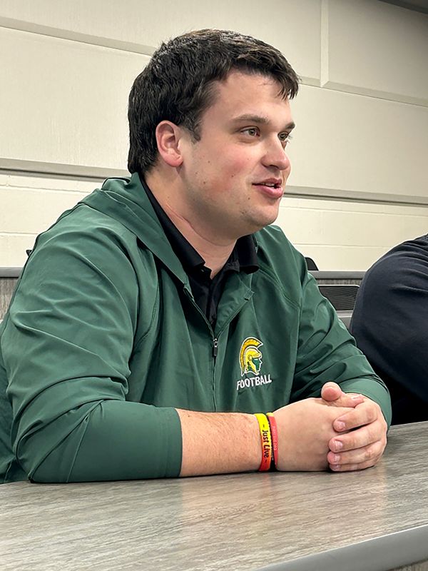 Head Football Coach Robbie Strand shared details of the girls flag football team with the board. Photo by Wanda Hanson
