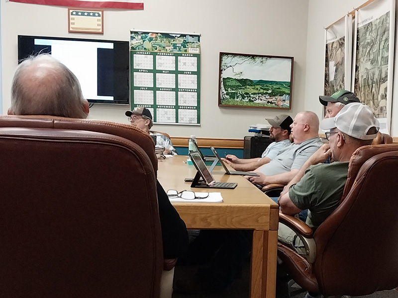The Rushford Village Council listens in at the April 21 meeting. Pictured clockwise from left are Councilor Bob Hart, Zoning Administrator Jon Pettit, Councilor Travis Link, Mayor Dennis Overland, and Councilors Rick Ruberg and Mike Ebner. Photo by Kirsten Zoellner