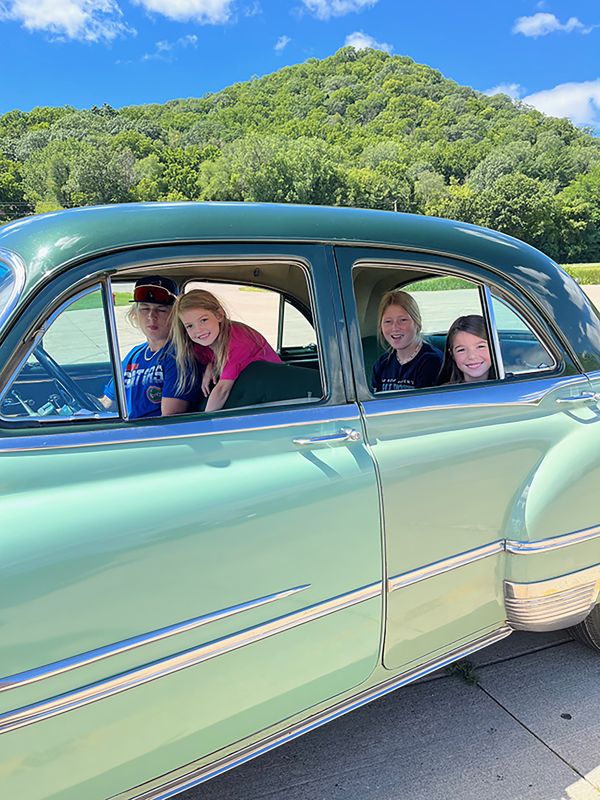 Sandy’s grandkids ready for a drive in Zeke. Photo submitted