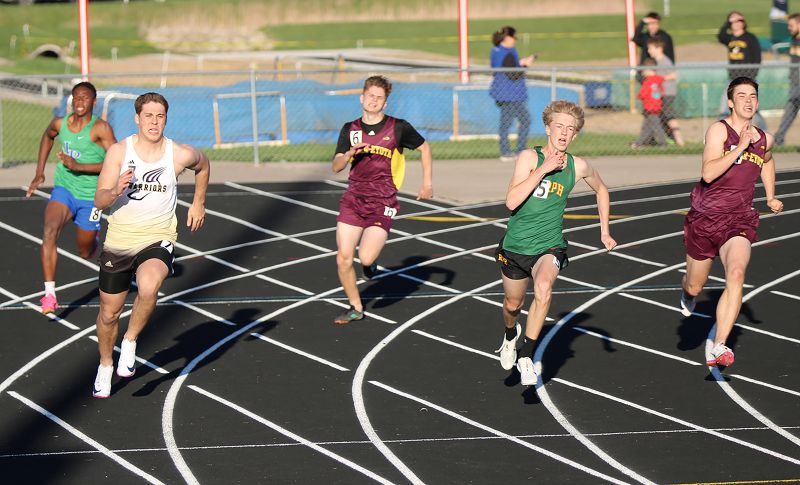Rounding the corner of the 200-meter race at the R-P/H “Best of the Bluff” track and field meet are notably Caledonia/Spring Grove’s Coby Hammell (left) and RPH’s Hunter Rislov (second from right). Hammell took third in the race but first in the 100, while Rislov took second in the 200, tied for third in the 100. Photo by Paul Trende
