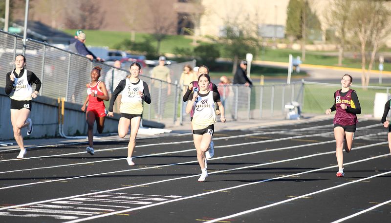Caledonia/Spring Grove’s Finley Wait leads the pack that also includes her teammates Jayce Westland and Kamrin Thies in the 200-meter race at R-P/H’s “Best of the Bluff Meet.” Wait, a 7th grader, notably won the 100, 200, and 400 races. Photo by Paul Trende