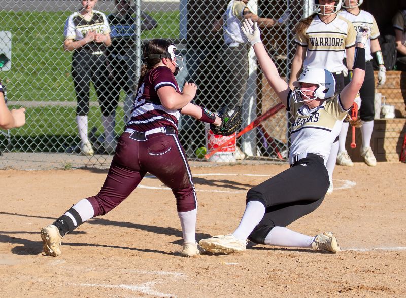 Caledonia’s Nora Staggemeyer and Chatfield’s Rylee Urban will collide at home plate with Staggemeyer out in the team’s TRC matchup. But the Warriors beat the Gophers 6-1, Cotter twice, 5-4 and 7-1, and Stewartville 10-1, as #7 in Class AA Caledonia improved to 11-1 on the year. Photo by Leif Erickson
