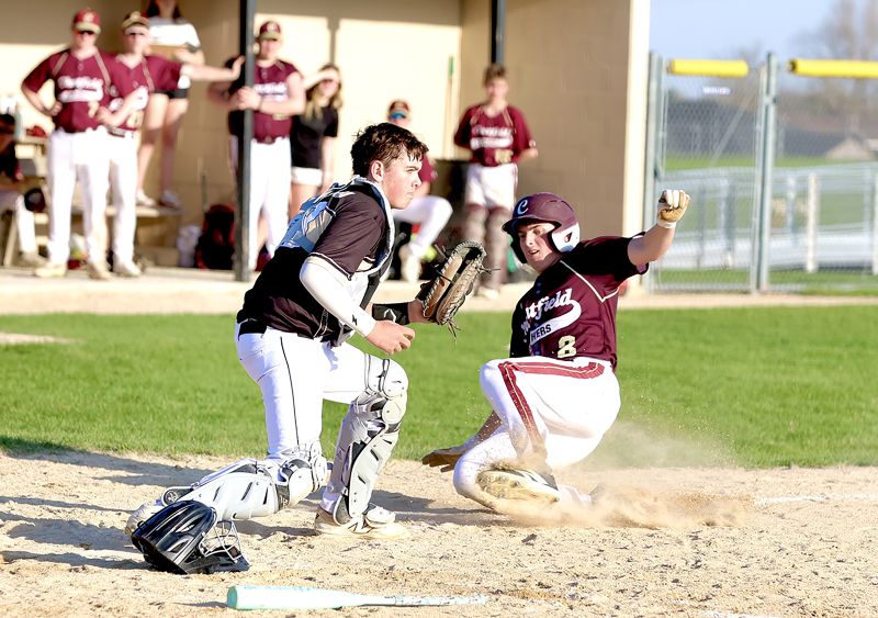 Caledonia catcher Braiden DeFlorian will record the force out at home base of Chatfield’s Jackson Johnsrud in the teams’ TRC matchup, a 6-4 Gopher win. Chatfield went 3-2 on the week to improve to 3-10. Caledonia went 2-3 and they are 7-3. Photo by Craig Johnson