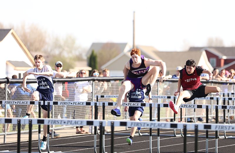 Two of the boys’ standouts at GMLOKS’ home track and field meet were Calum Sween (left) and Carter Glynn (right). Glynn took first in the 800-meters and 4x200, second in the Triple Jump (above). Sween took first in the above 110-meter hurdles (above), third in the Shot Put, and fourth in the Discus.’ Photos by Christine Vreeman