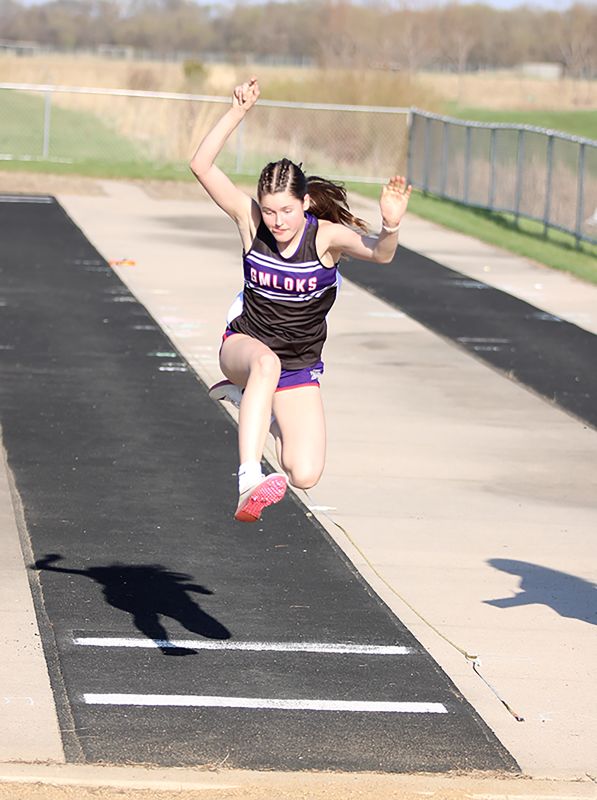 A gal standout at the GMLOKS home track and field meet was Maddy Montgomery. With a number of her teammates absent (class trip), Montgomery took first in both the Long Jump and Triple Jump. Photo by Paul Trende