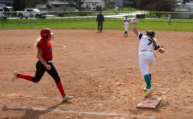 Spring Grove’s Kallyn Morken is out by a couple steps as FC/L’s Hailey Erickson takes the throw at first base, but the Lions took the non-conference game 12-4. Photo by Deb Finseth