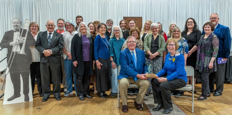 Band members and their spouses attended the induction. Note the cardboard cutout of founder Jim Perkins. Photo submitted