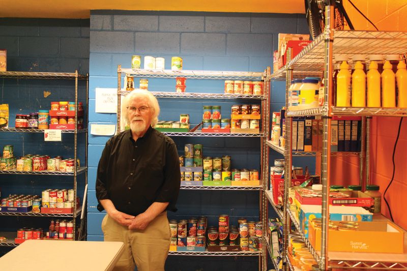 Steve stands in the food shelf located in the basement of the Chatfield United Methodist Church. The food shelf provides more than 2,000 pounds of food each month to those in need. Photo by Jason Sethre