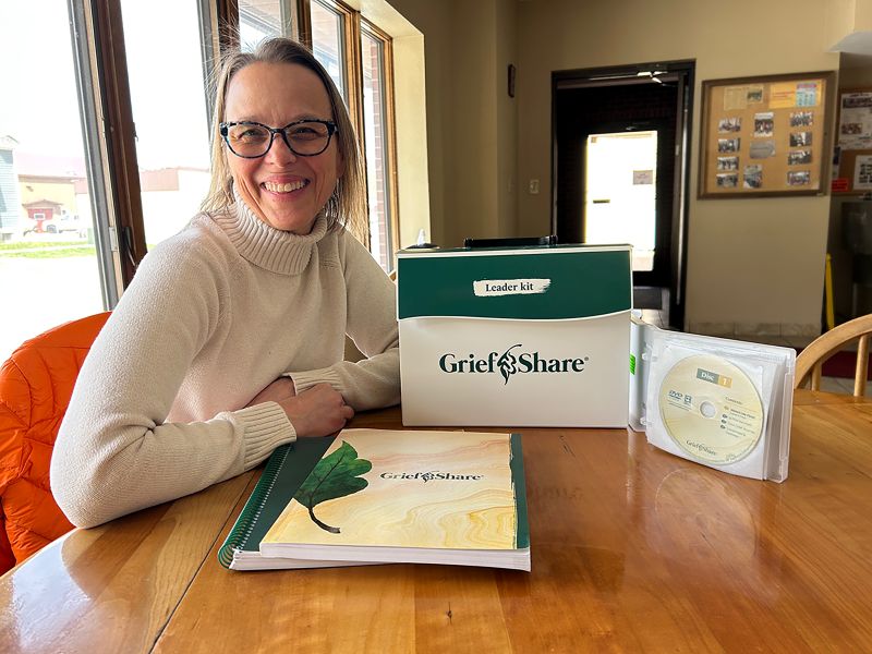 Leader Becky Stocker shares some of the GriefShare materials that help her prepare to lead the group. Photo by Wanda Hanson